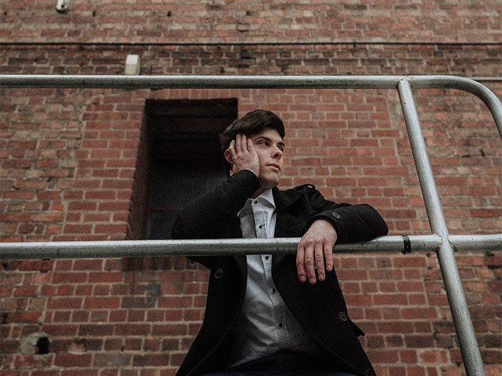 young man on balcony